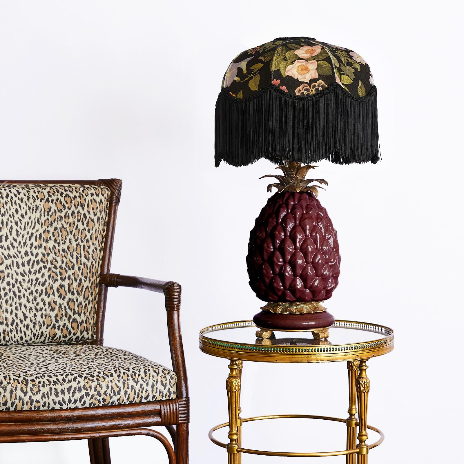 a lamp on a table next to a chair