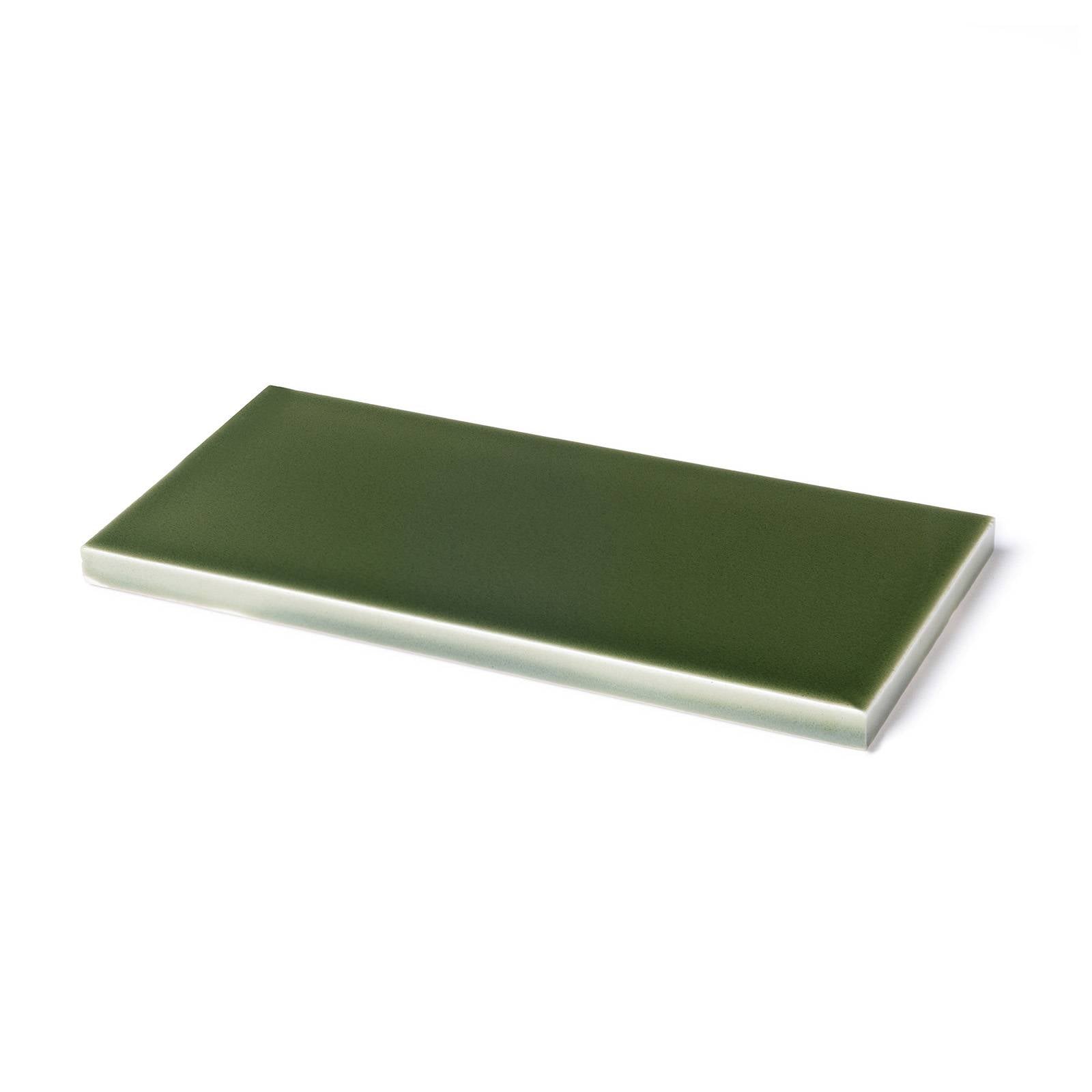 a green rectangular object on a white background