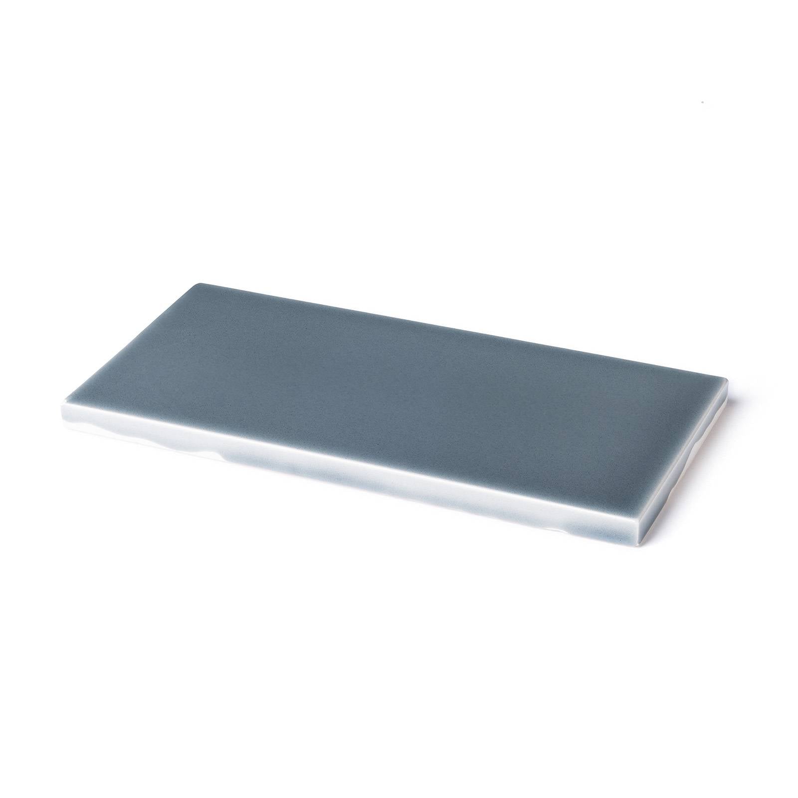 a grey rectangular object on a white background